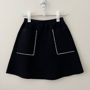 Size 1 black Sandro A line short skirt with patch pockets
